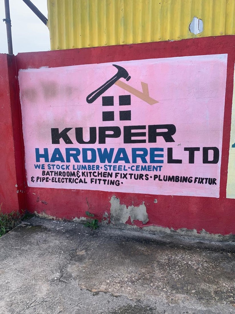 Kuper Hardware wall sign: we stock lumber, steel, cement, bathroom and kitchen fixtures, plumbing fixtures and pipe, electrical fittings