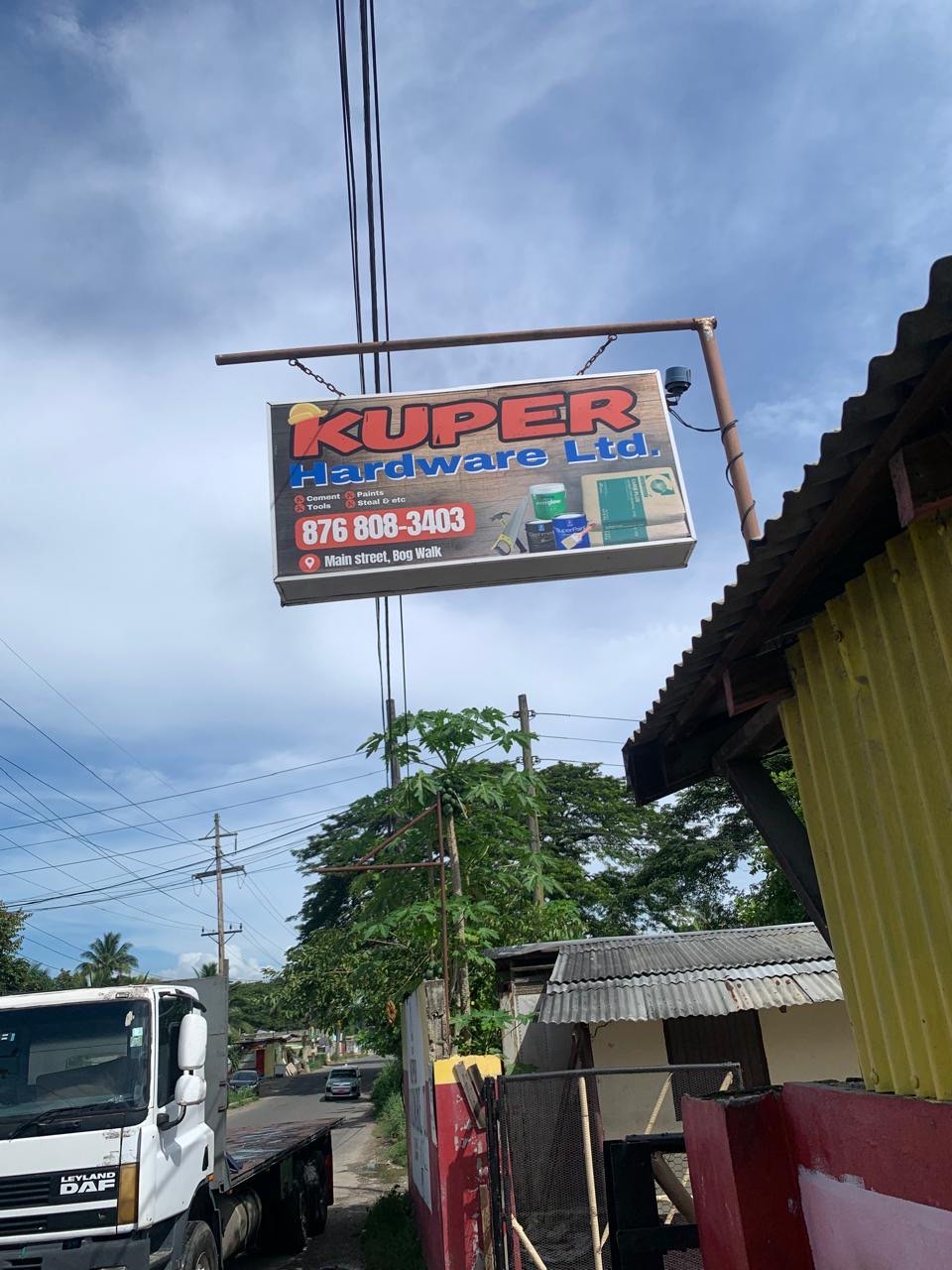 The Kuper Hardware Ltd sign over Main Street, Bog Walk