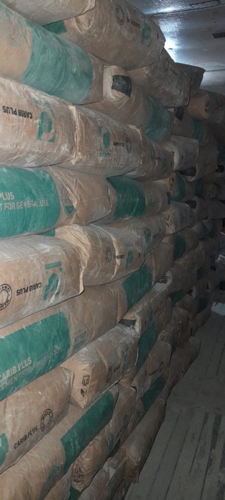 Stacked bags of Carib cement in the Kuper storeroom